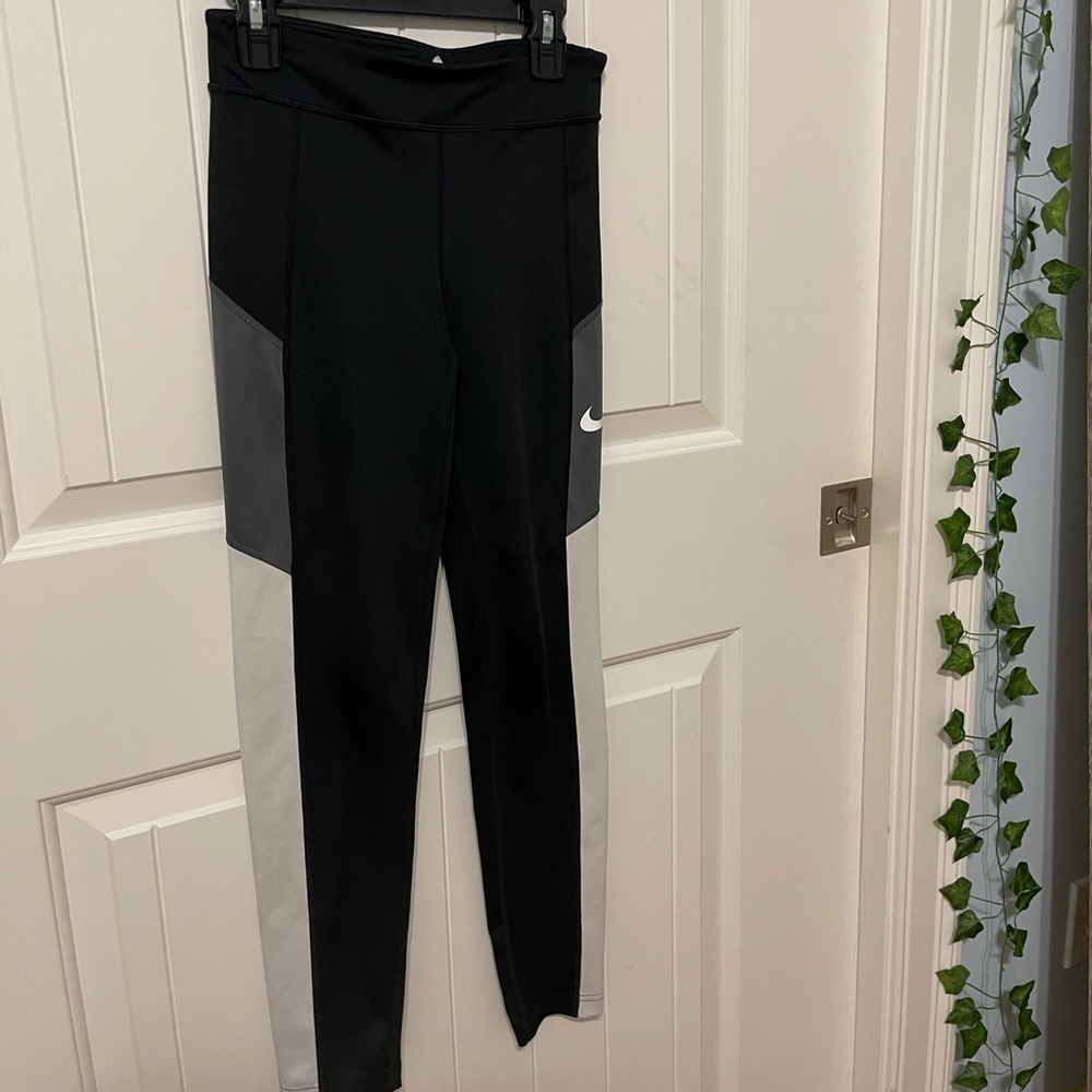 Black, grey, and white Nike dri-fit leggings
